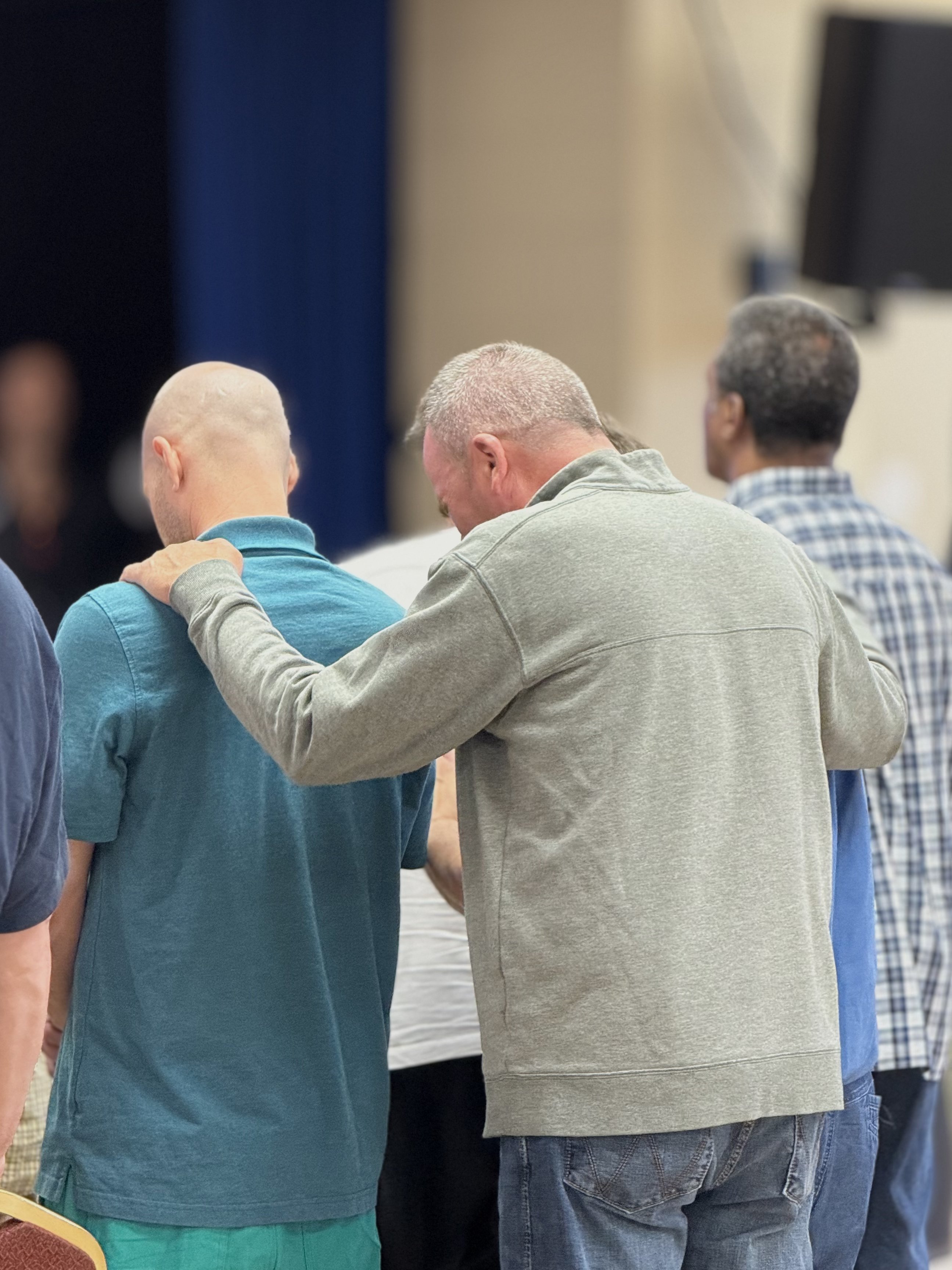 Large grill loaded with steaks and burgers at Wisconsin Men's Ministry event