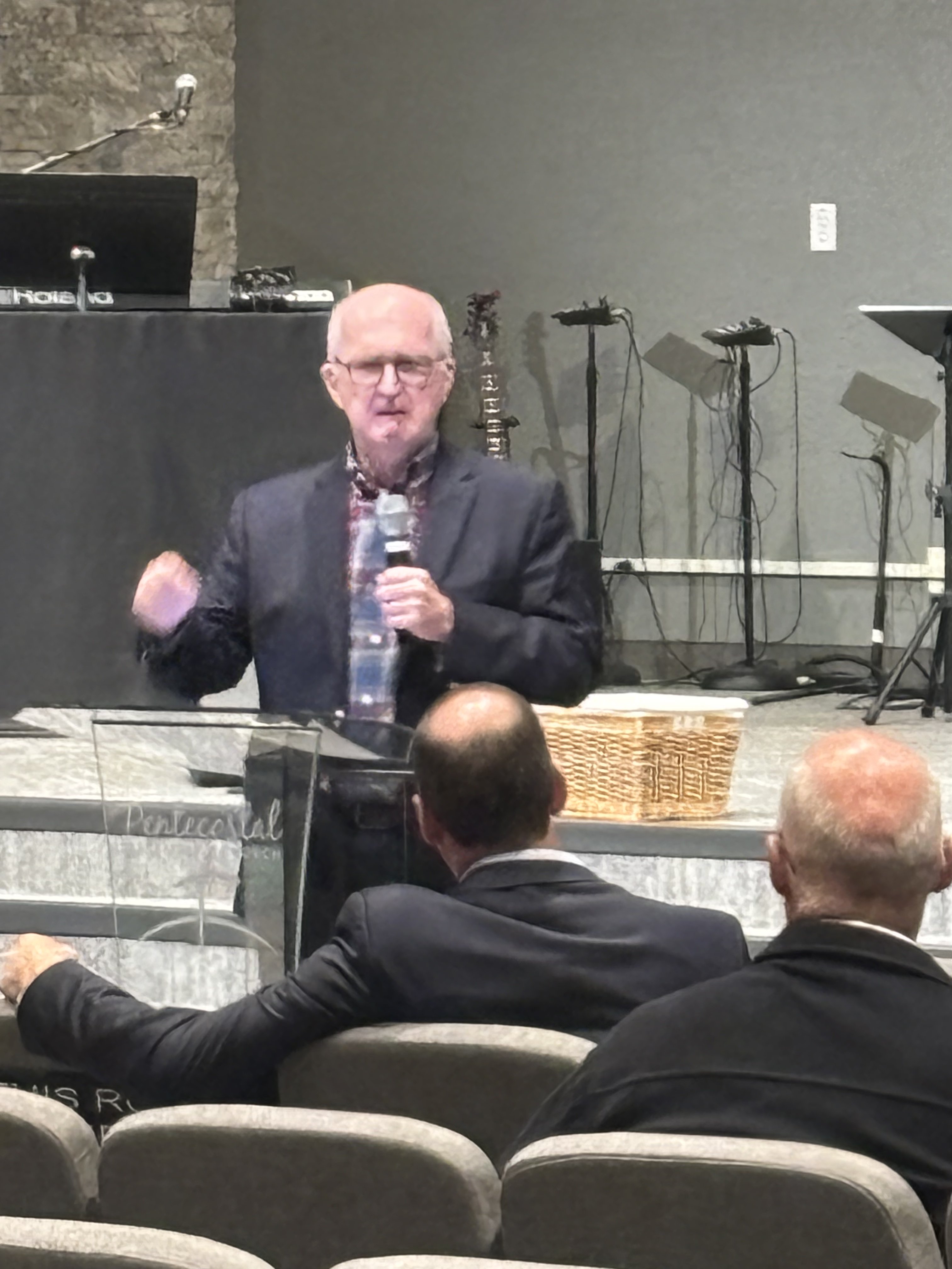Man speaking from lectern teaching at Wisconsin Men's Ministry session