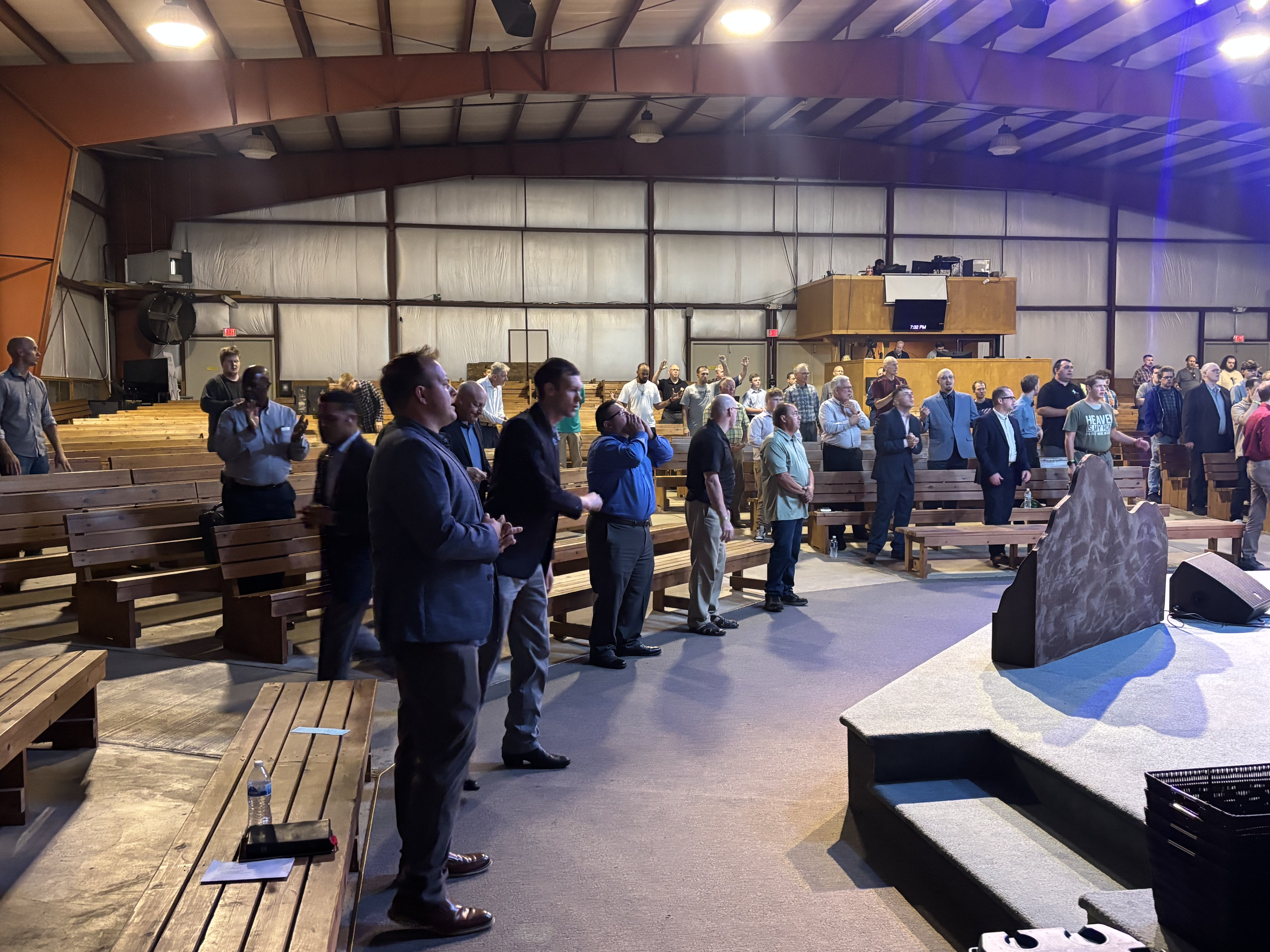 Wide shot of Wisconsin Men's Camp auditorium during worship service